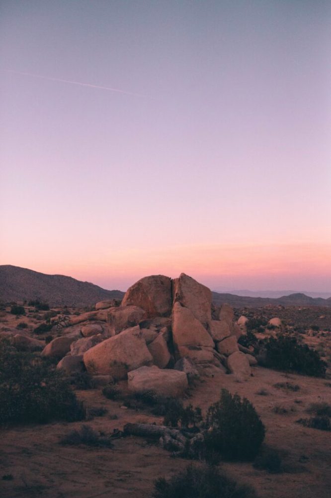 a canyon with a sunset in the background