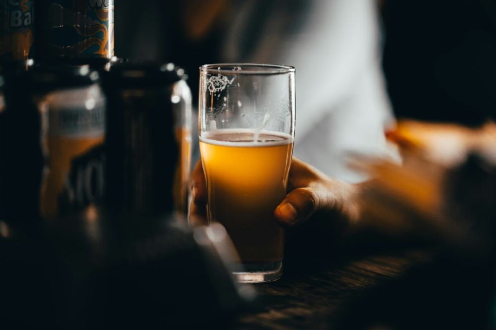 a glass of beer on a table