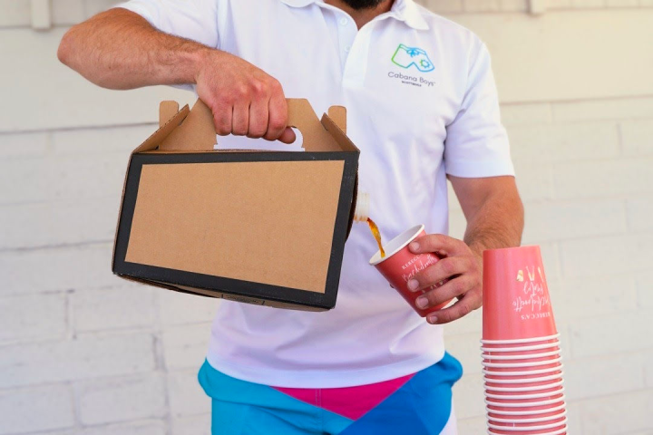 a man standing in front of a cake