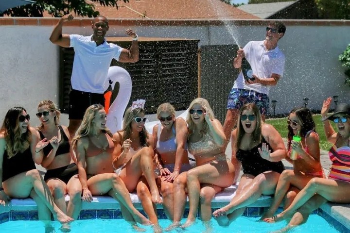 a group of people sitting in a pool