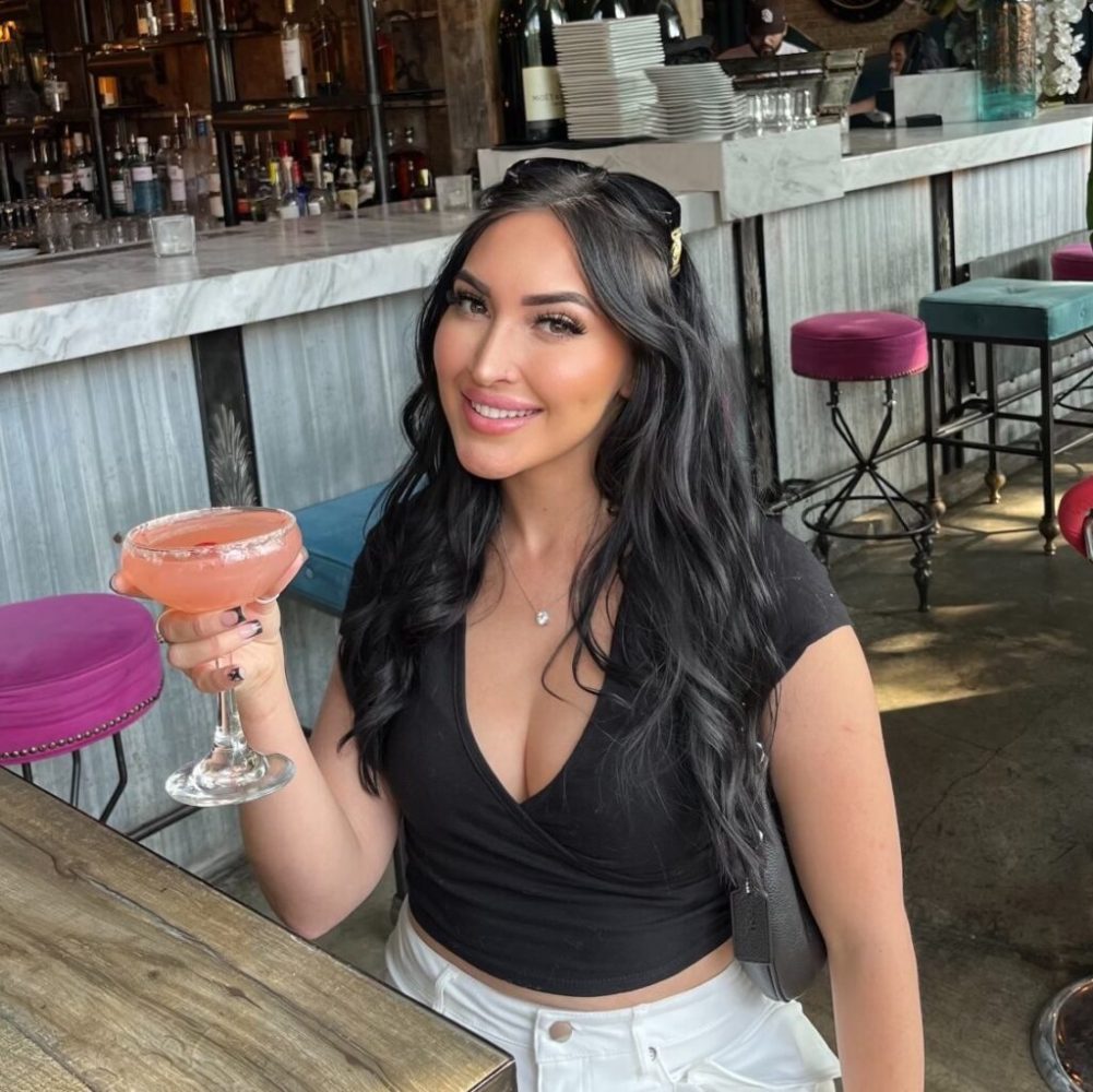 a woman sitting at a table in a restaurant