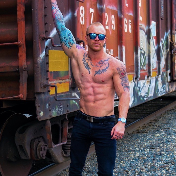 a man standing in front of a train