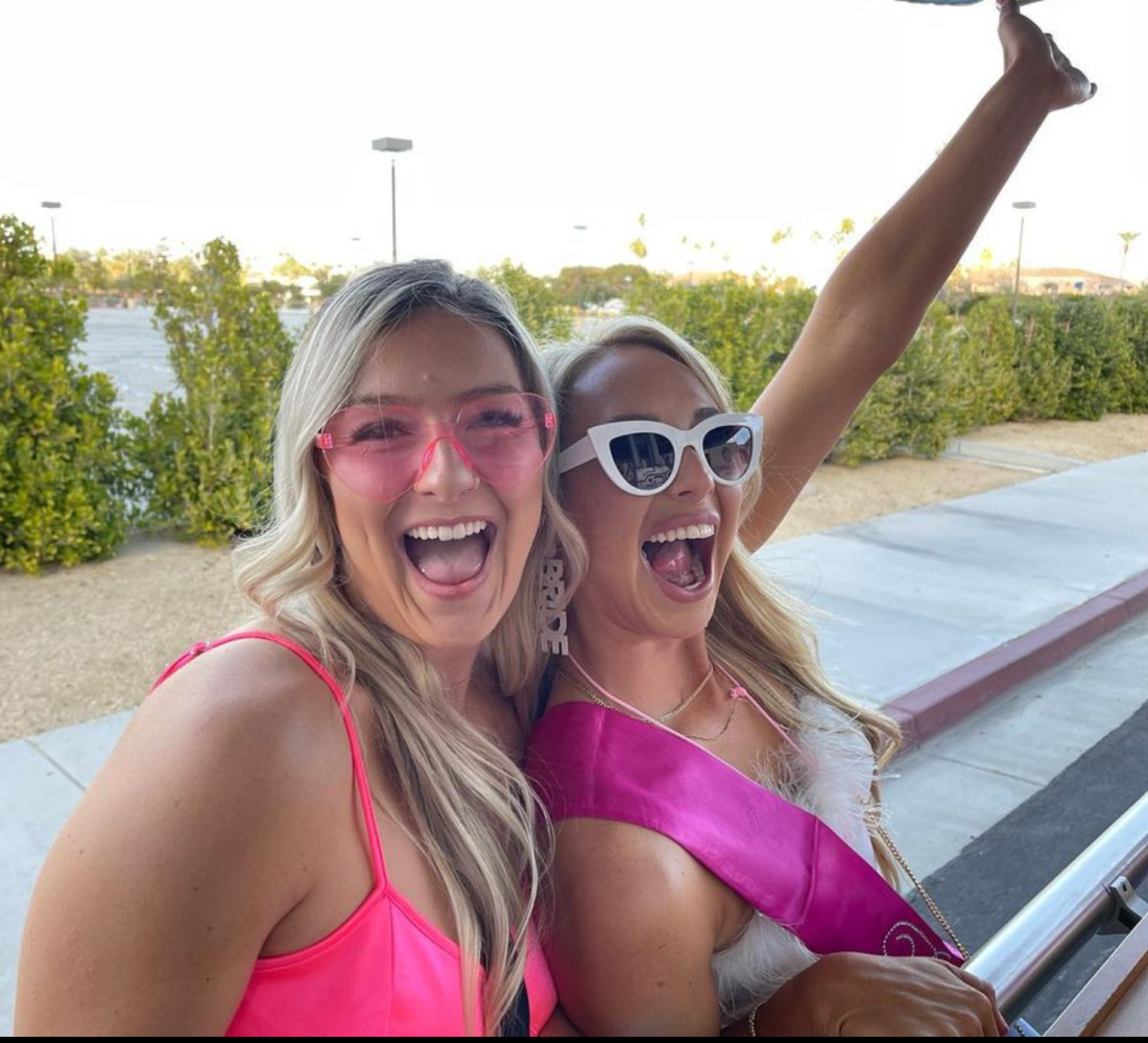 a woman wearing sunglasses posing for the camera